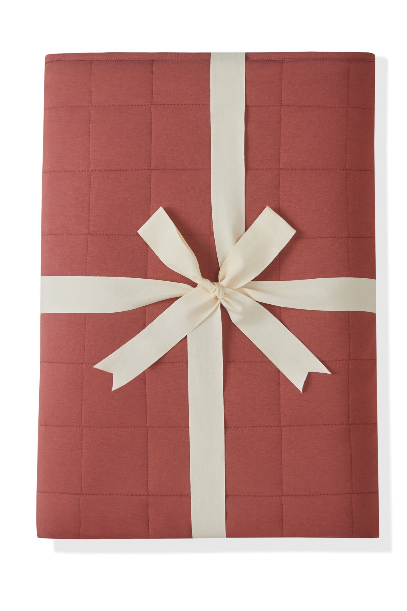 Youth Blanket in Ember 2.5 packed in ribbon on a white background