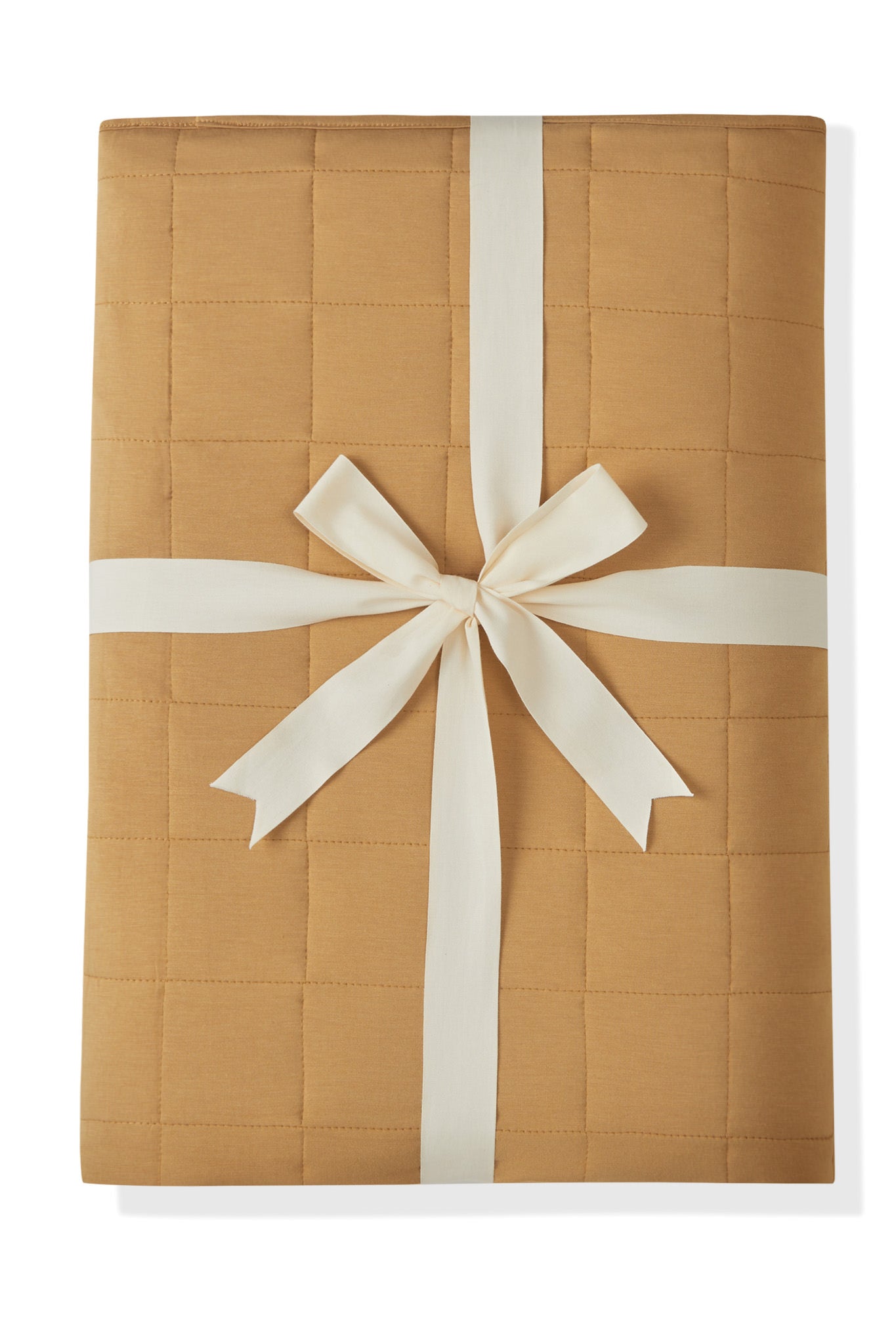Youth Blanket in Ochre 2.5 packed in a ribbon on a white background