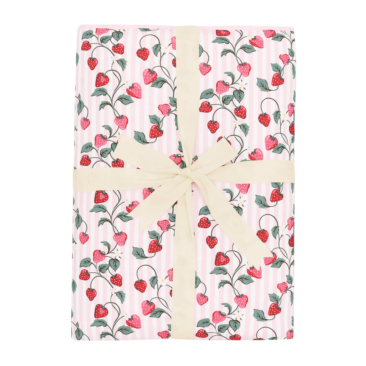 Youth Blanket in Strawberry Fields 2.5 shown in its packaging tied with a linen bow