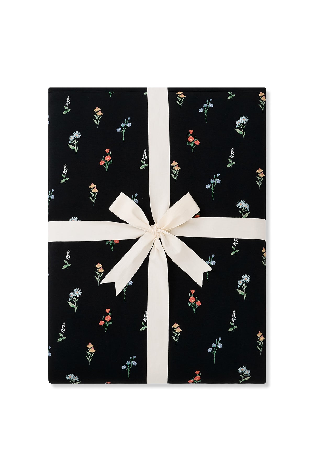 Black Youth Blanket in Wildflower 2.5 print packed with a ribbon on a white background