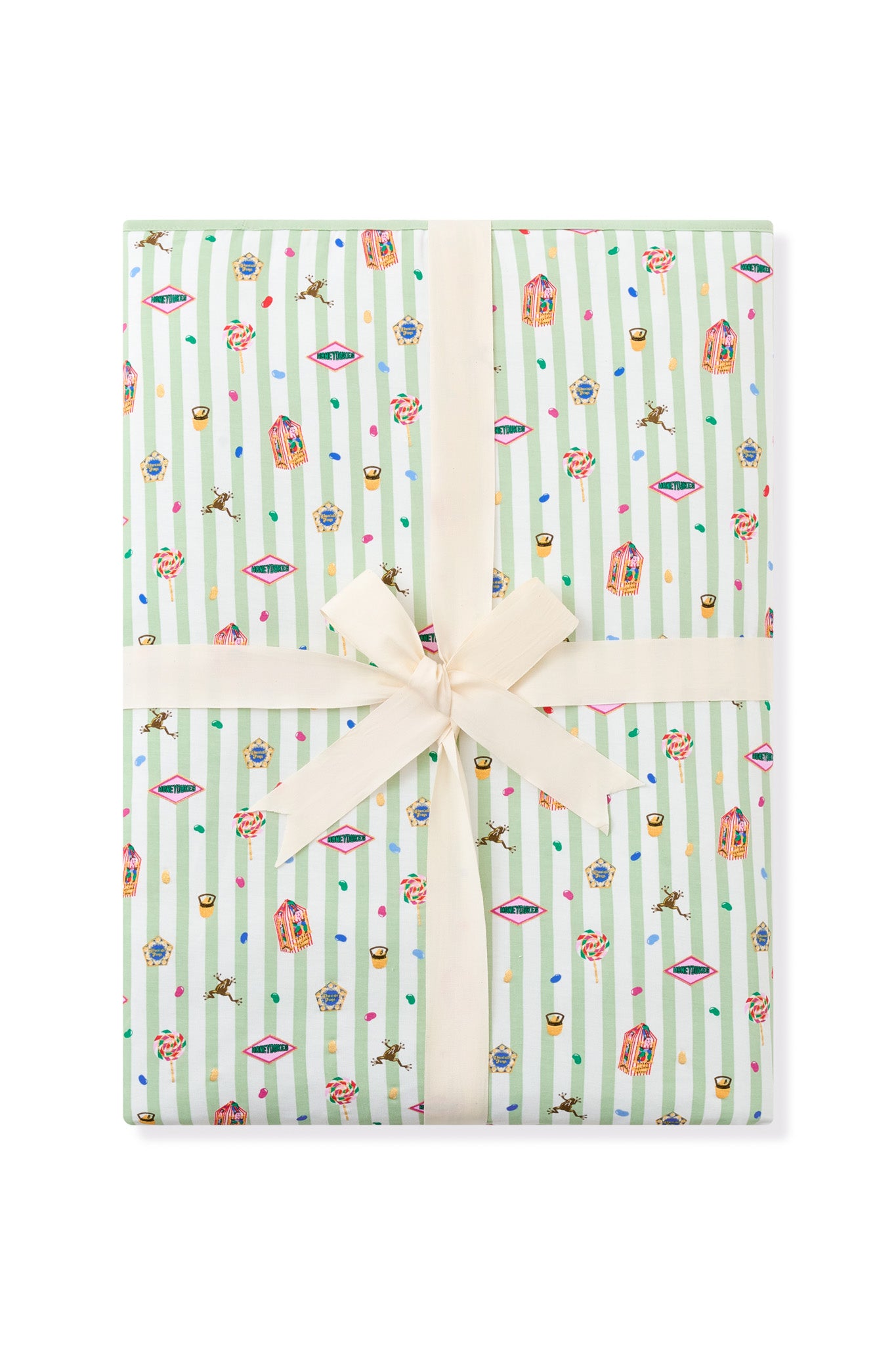 Packed green and white striped youth blanket with colorful Harry Potter pattern print with a ribbon a a white background