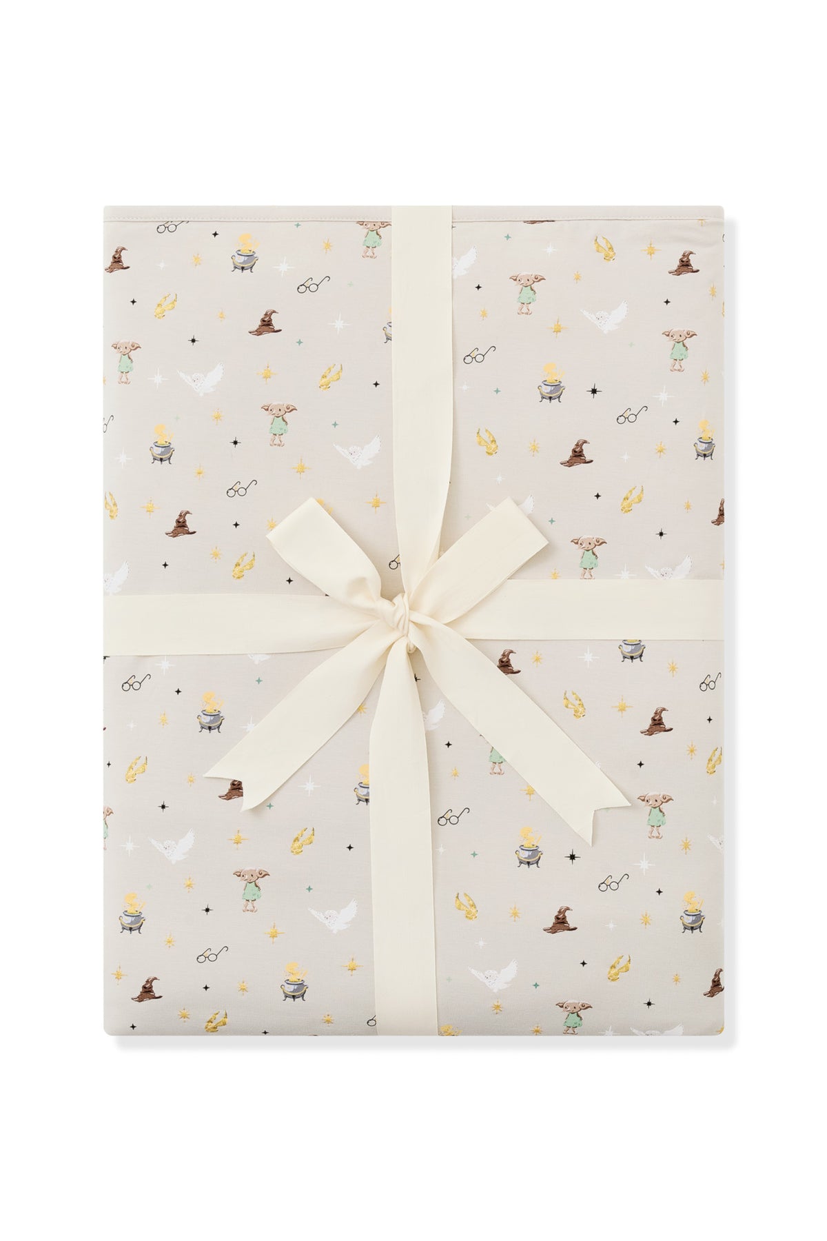 Packed Beige Youth Blanket in Harry Potter pattern print with a ribbon on a white background