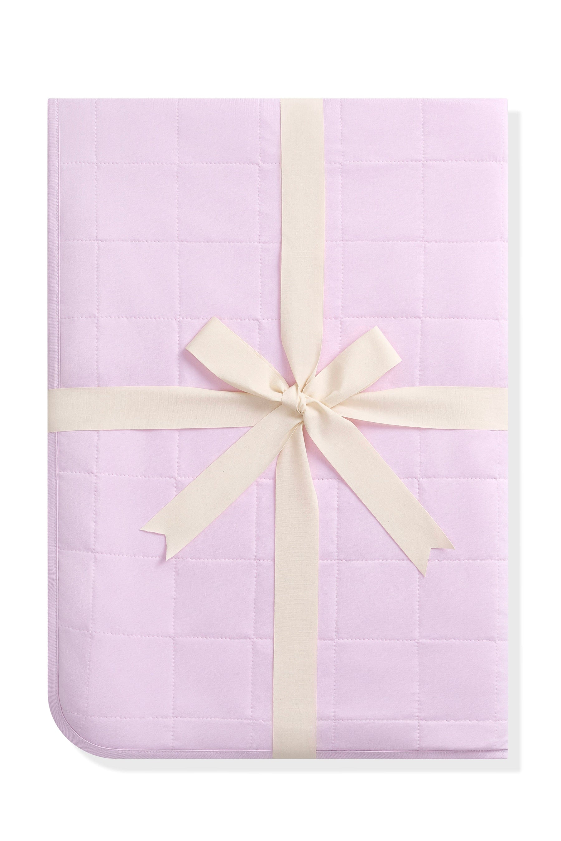 Youth Blanket in Thistle 1.0 shown in its packaging tied in a linen bow