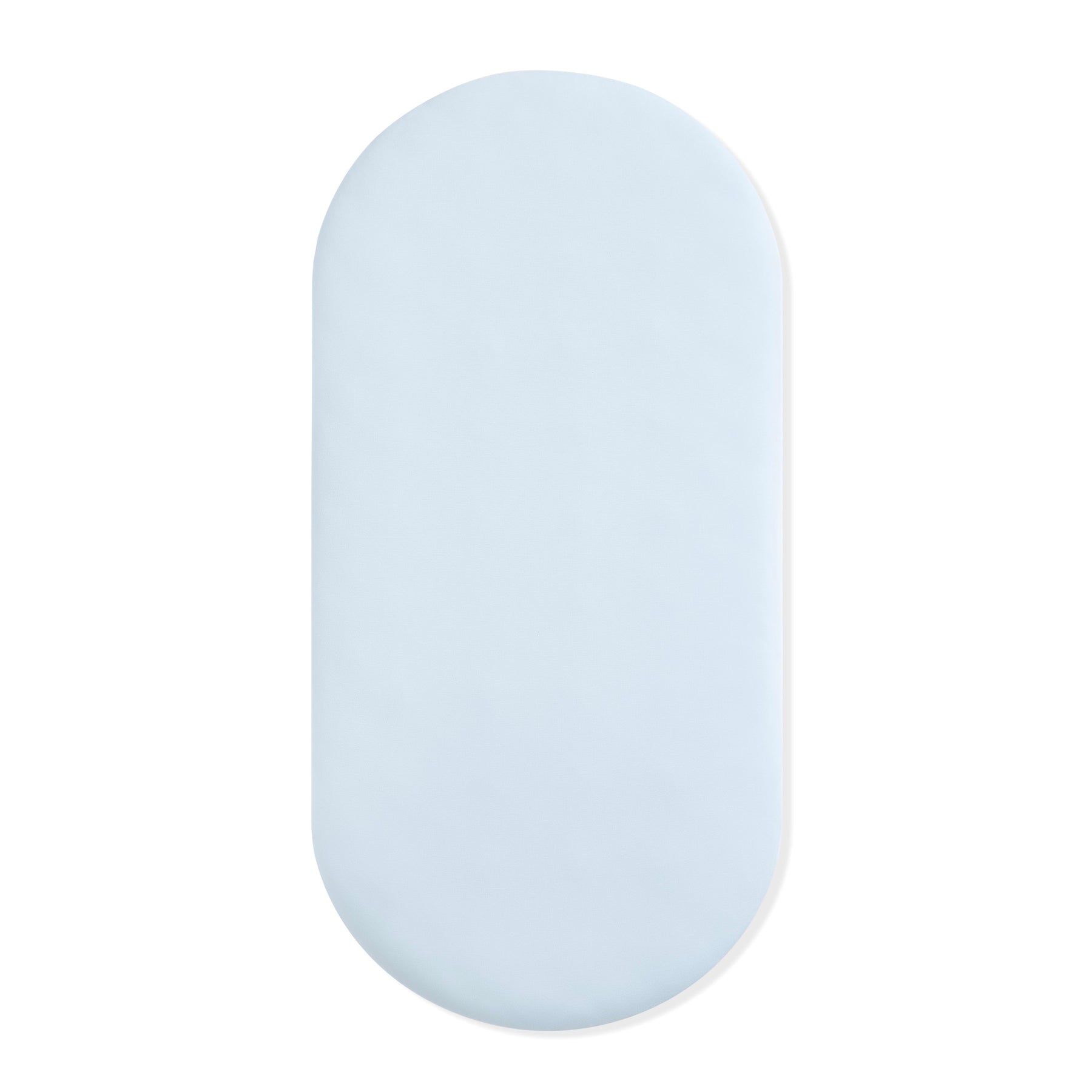 Oval Bassinet Sheet in Breeze shown on a bassinet mattress