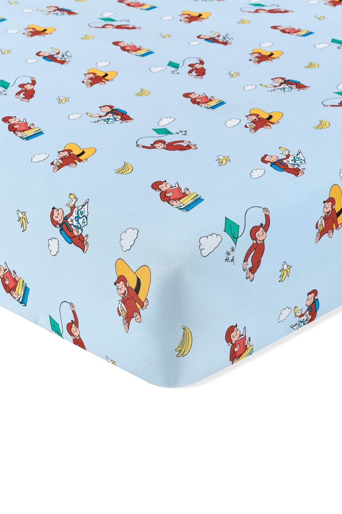 Blue Crib Sheet in Curious George print on a white background
