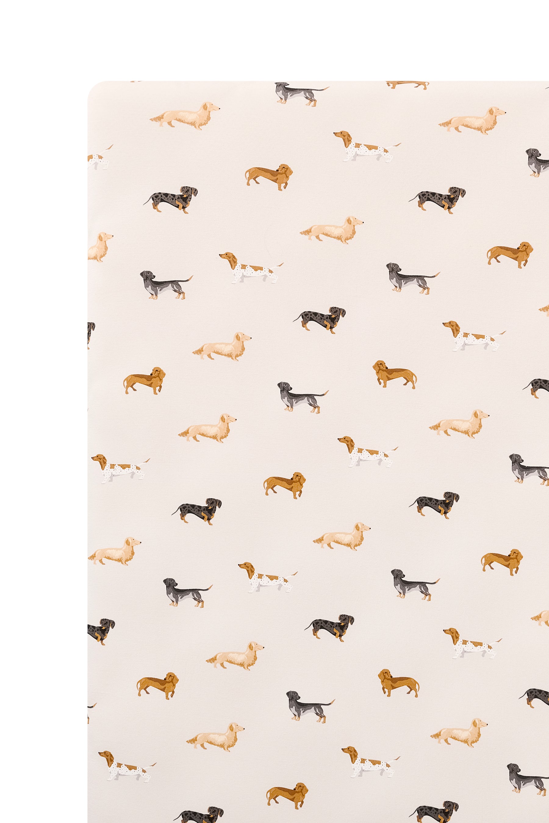 Beige Crib sheet with Dachshund print on a white background
