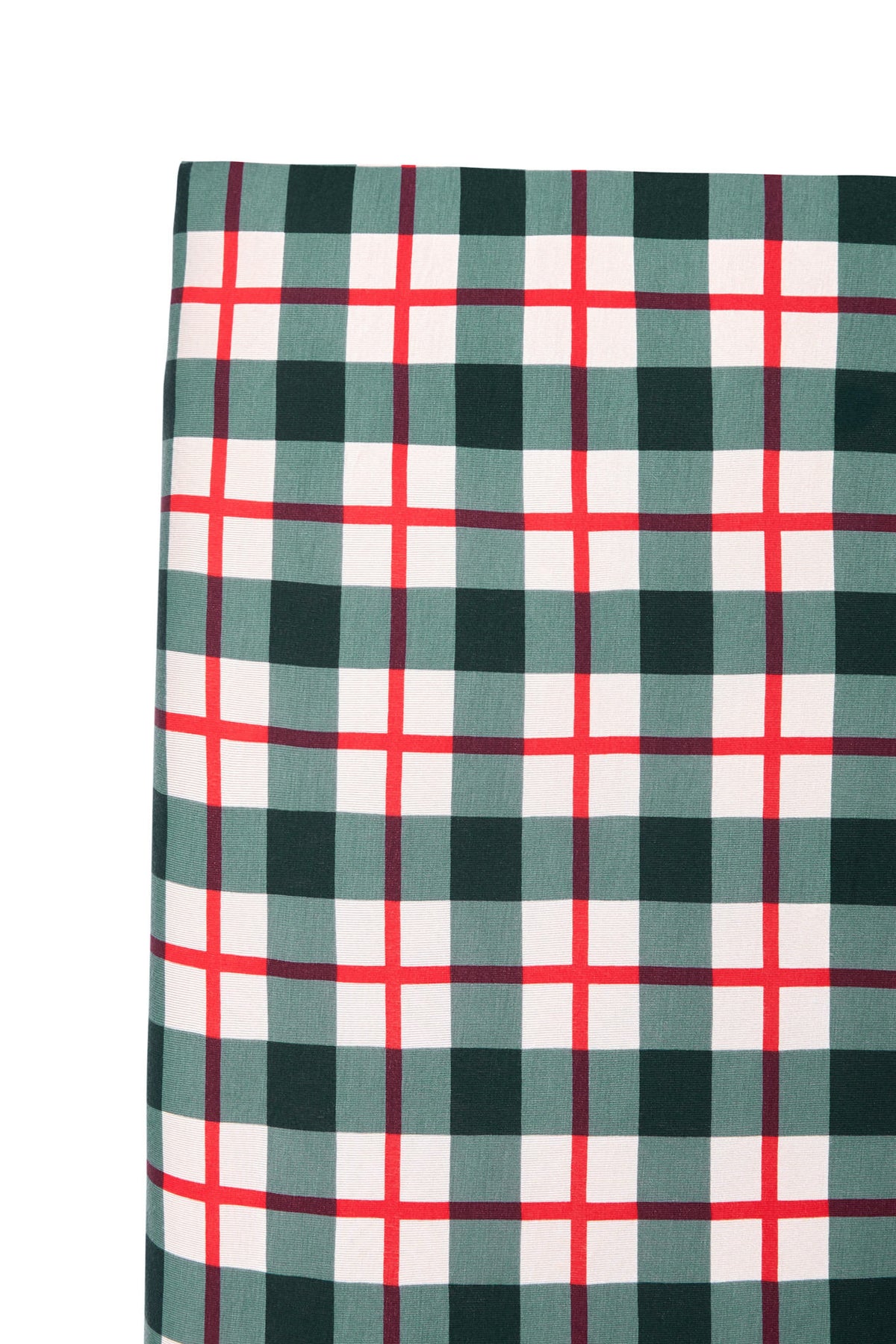 A close-up of a plaid fabric pattern with dark green, white, and red intersecting stripes, shown against a plain white background.