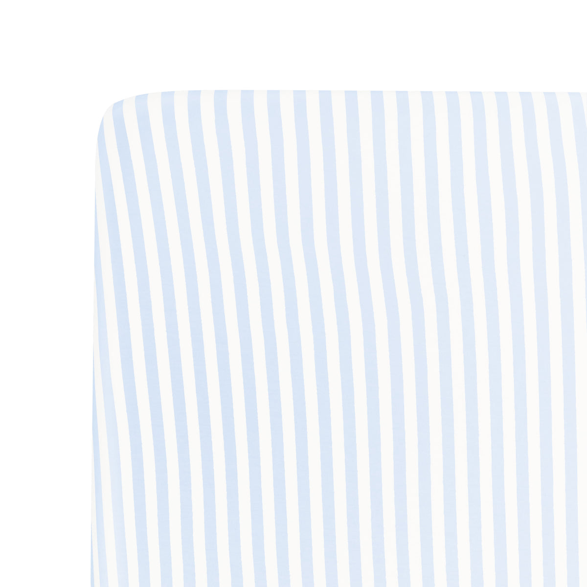 Close up of a corner of the Crib Sheet in Small Mist Stripe on a mattress