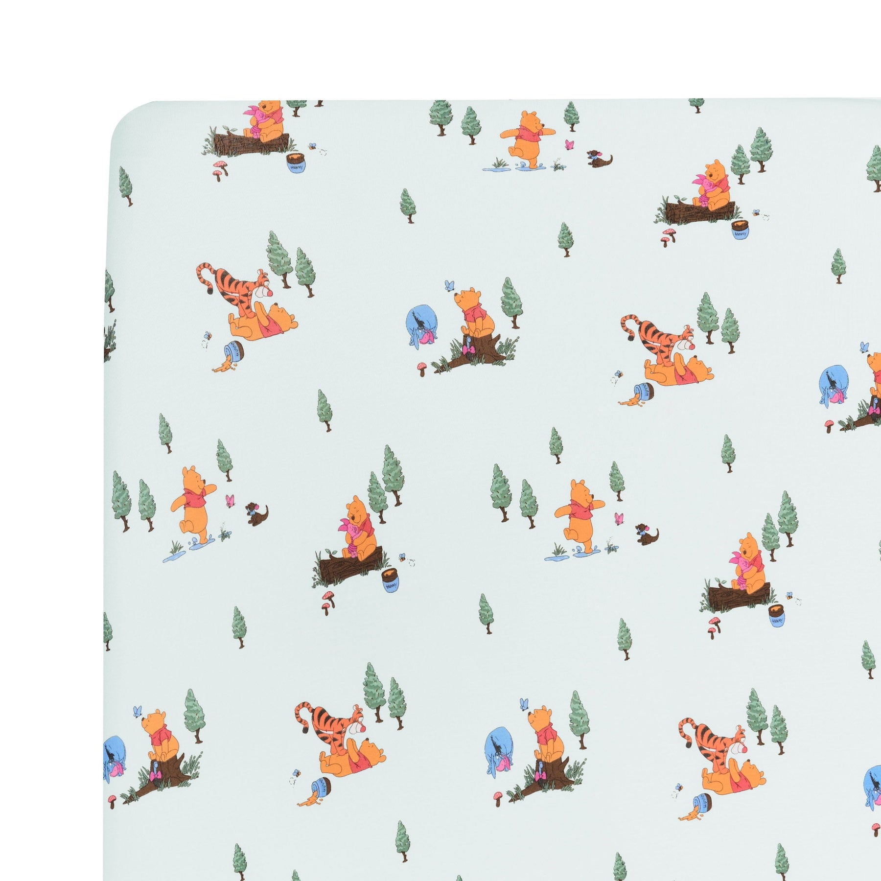 Close up of the Crib Sheet in Winnie the Pooh Hundred Acre Wood on a mattress
