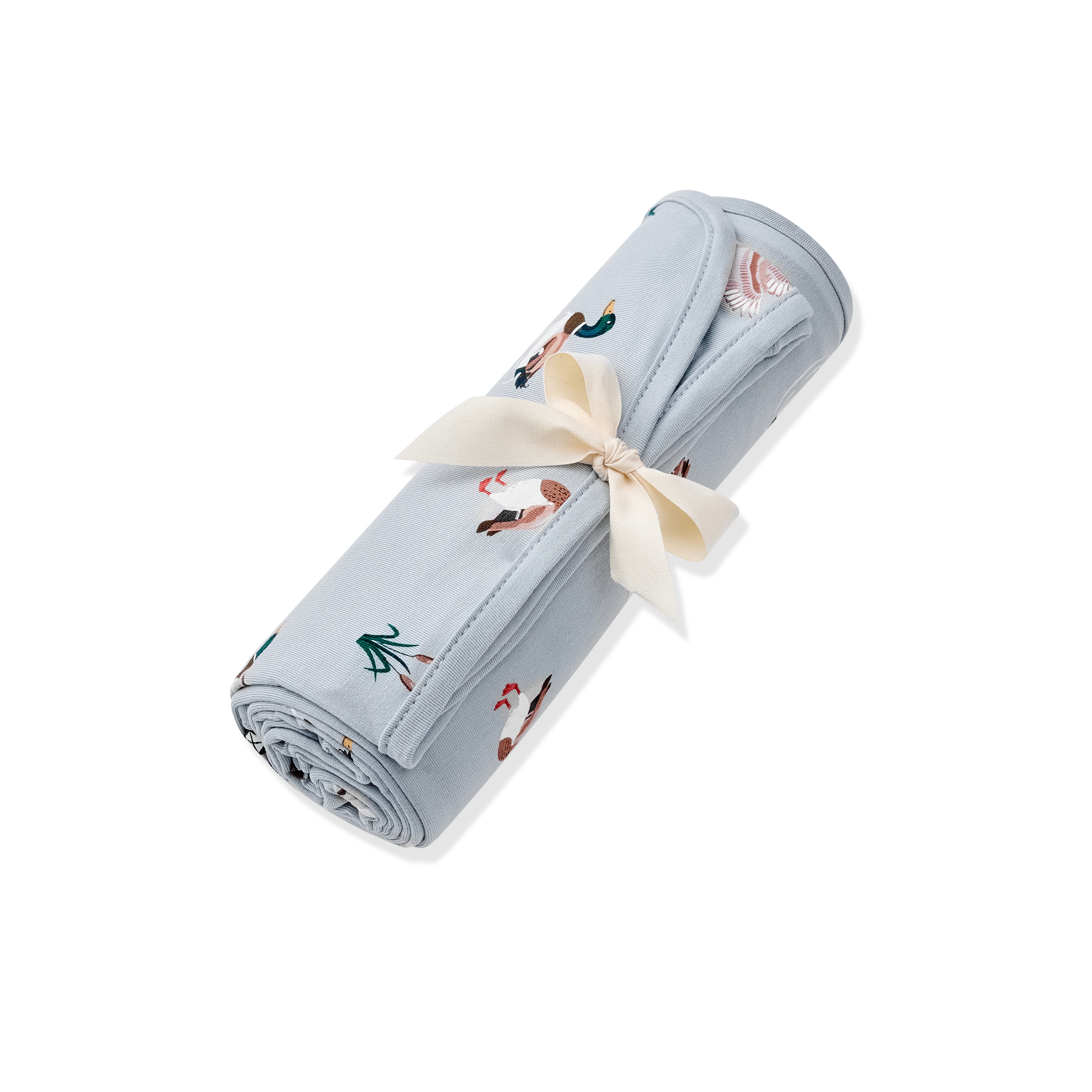 Swaddle Blanket in Mallard Duck shown rolled in its packaging tied with a linen bow