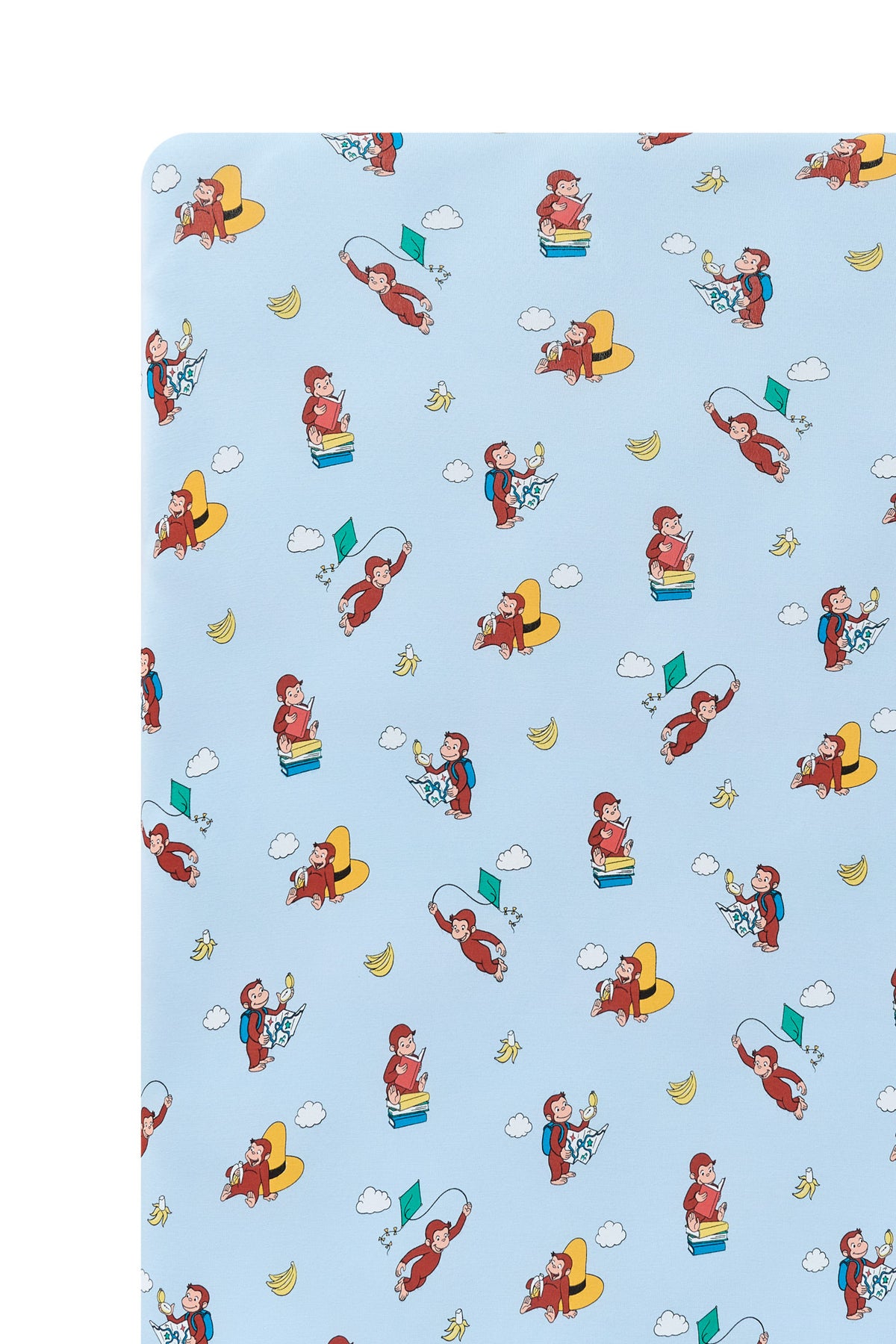 Close up of Blue Twin Sheet in Curious George print on a white background