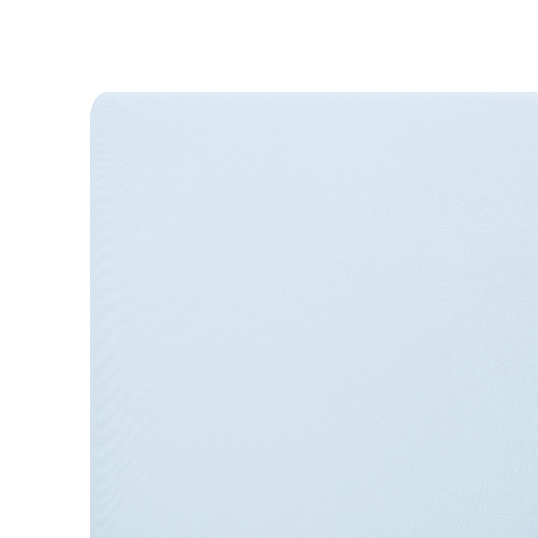 Close up of corner of the Twin Sheet in Breeze shown on a mattress