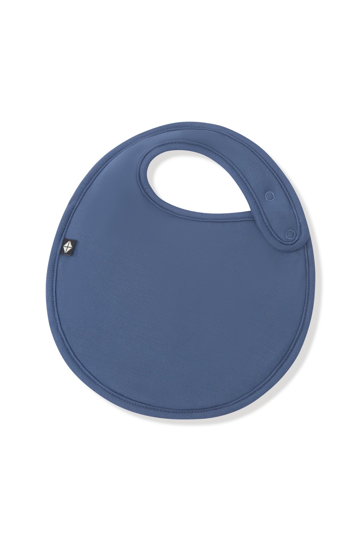 Front side of the Cushy Bib in Oxford showing the snap closures on a white background