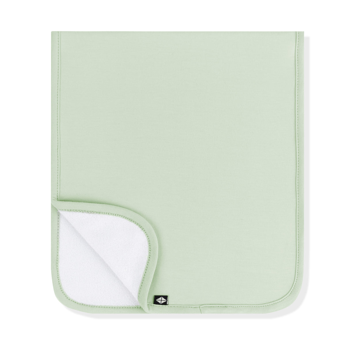 Burp Cloth in Basil folded in half with the corner folded upwards