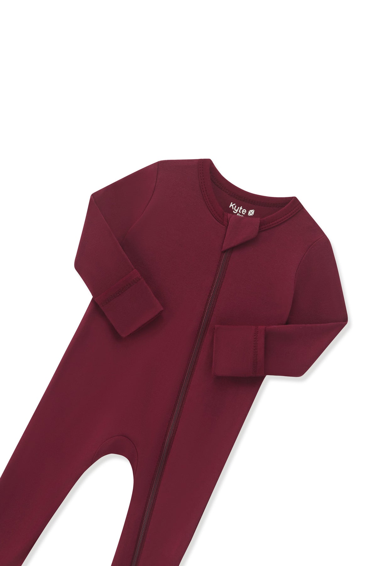 Close up of the zipper garage and fold over hand cuffs on the Zippered Romper in Burgundy on a white background