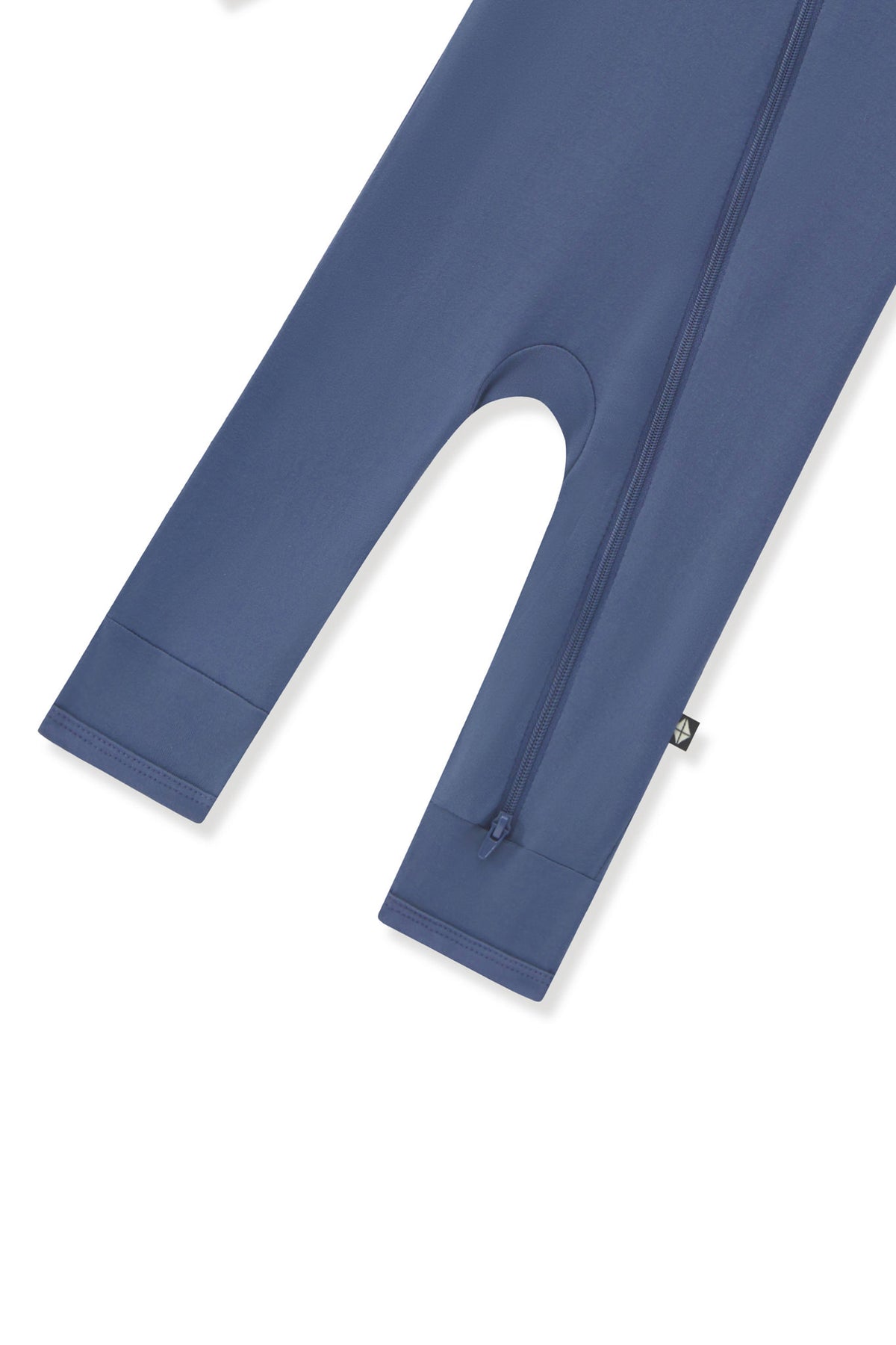 Bottom zipper shown on the leg of the Zippered Romper in Oxford on a white background