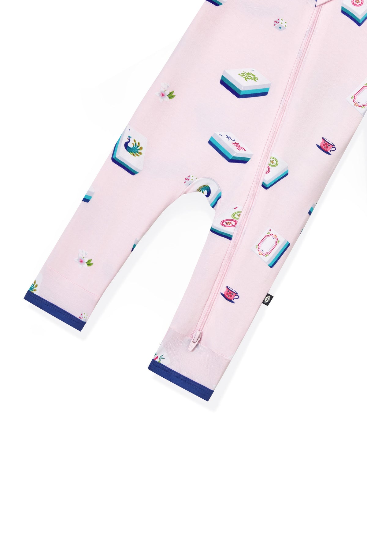 Bottom part of Pink Zippered Romper with Mahjong pattern on a white background