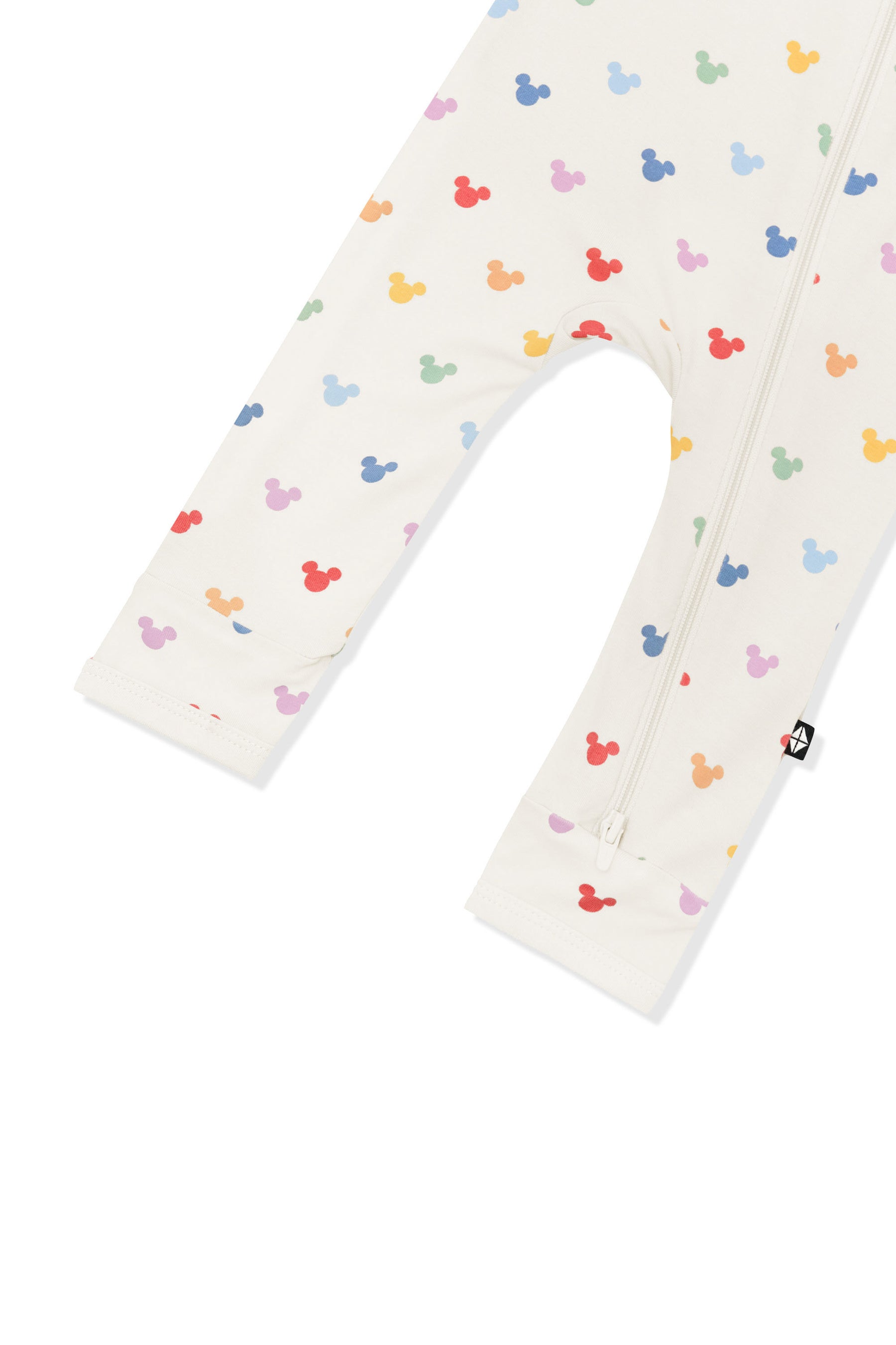 Bottom part of Zippered Romper in Pastel Mickey Mouse pattern on an oat background
