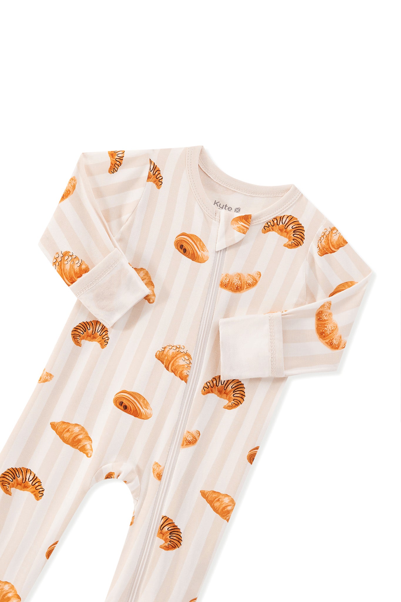 Zippered Footie in Croissant print with zipper garage on a white background
