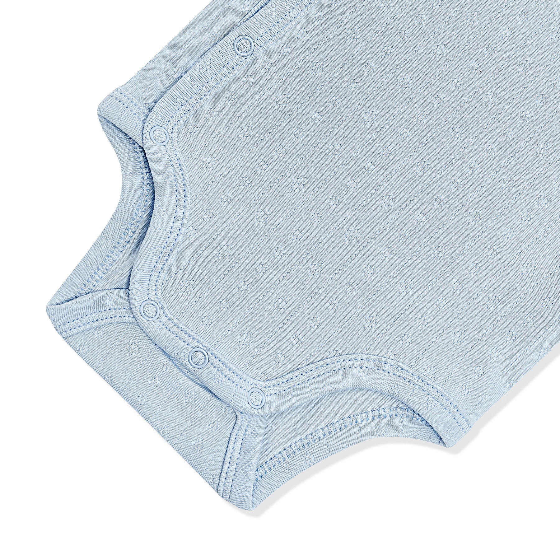 Close up of the inseam snap closure on the Pointelle Kimono Bodysuit in Breeze