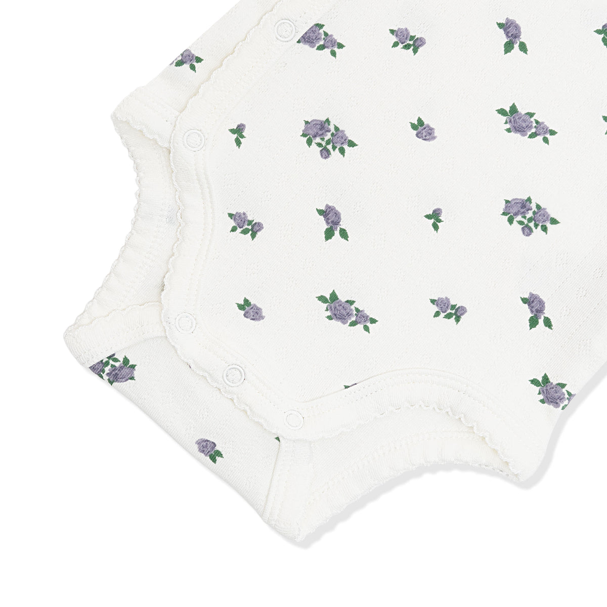 Close up of the picot trim and snap closures on the inseam shown on the Pointelle Kimono Bodysuit in Spray Rose