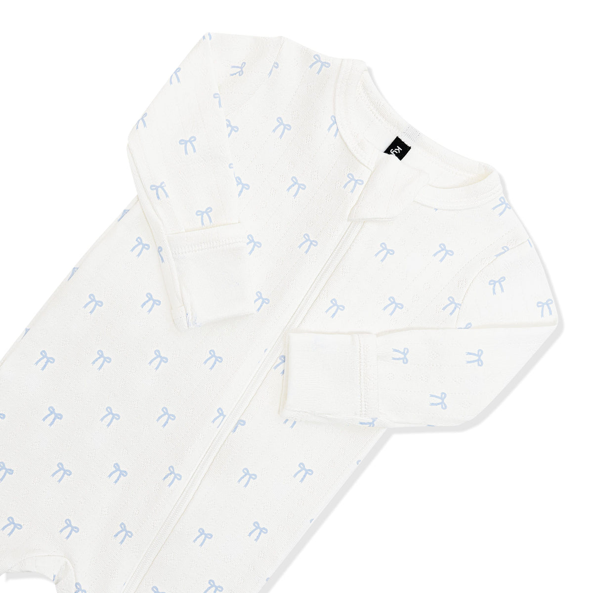 Close up of zipper garage and fold over hand cuffs on the Pointelle Zippered Footie in Sweet Blue Bow
