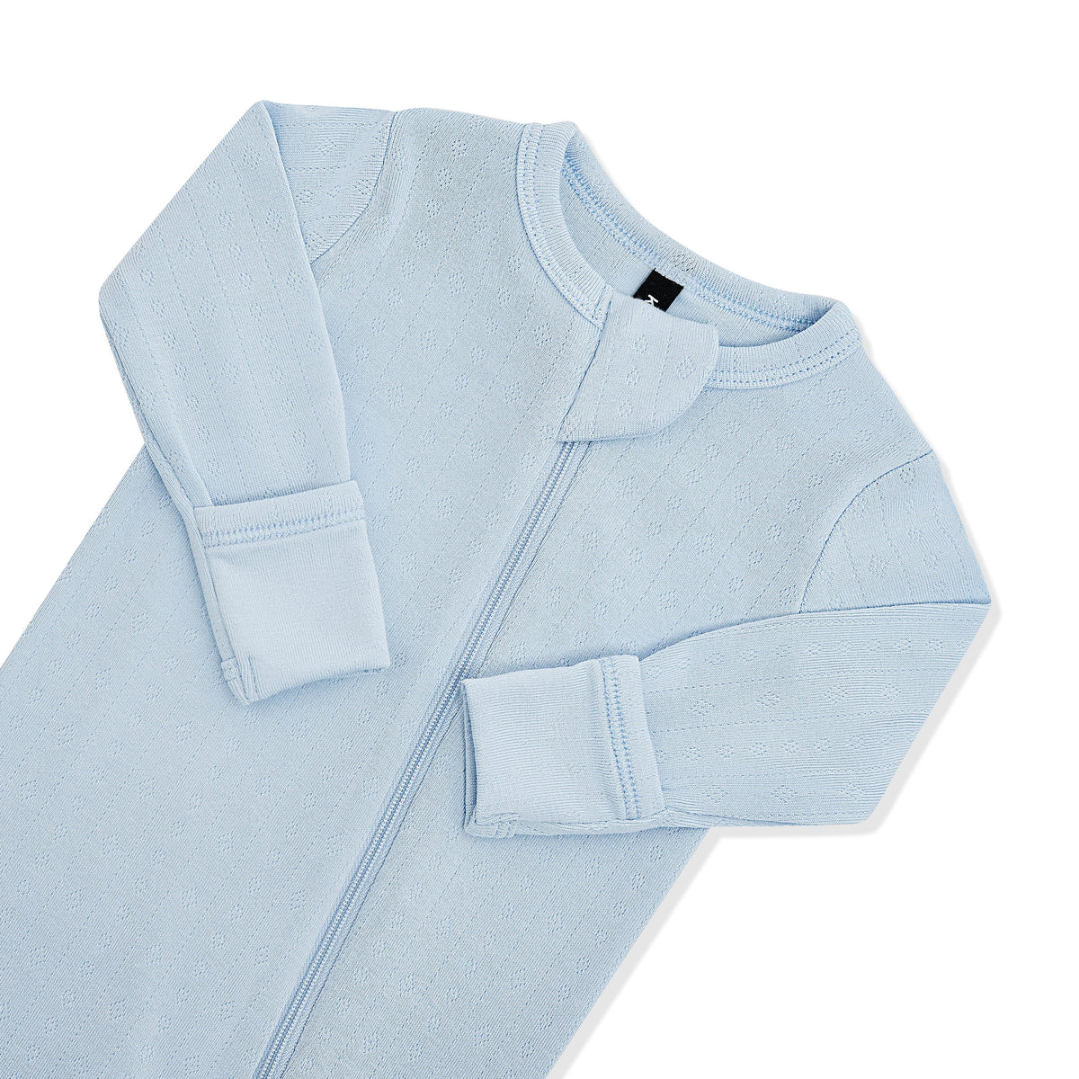 Close up of the zipper garage and fold over handcuffs on the Pointelle Zippered Footie in Breeze