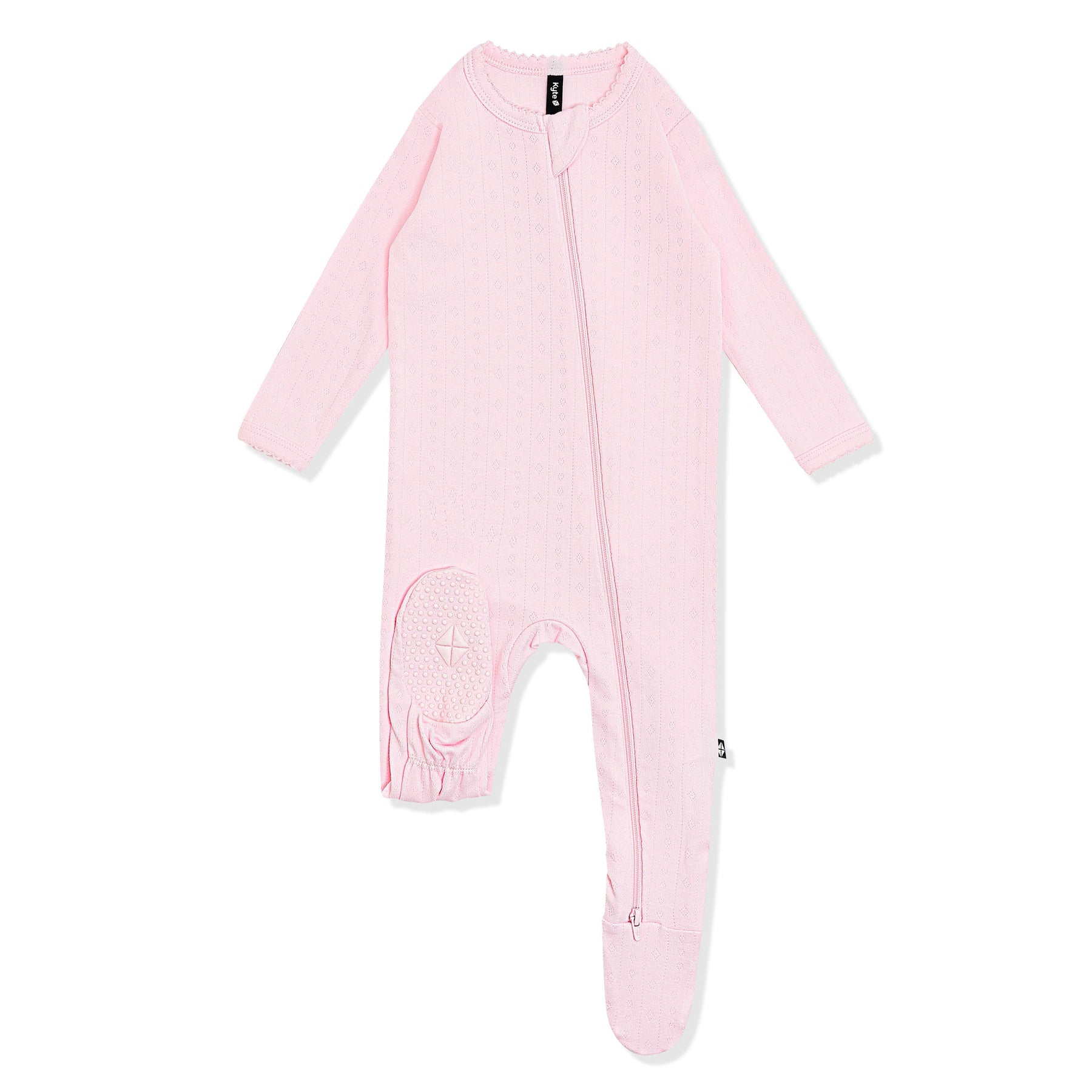 The bottom of the foot pad with the kyte baby log shown on the Pointelle Zippered Footie in Sakura
