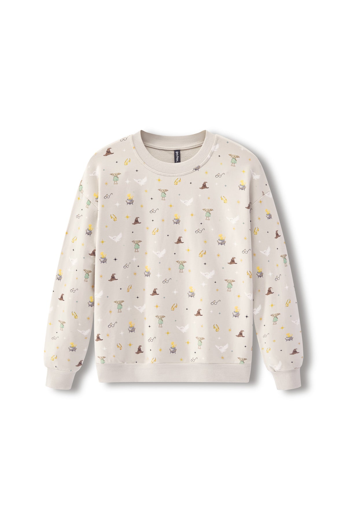 A cream-colored crewneck sweatshirt with an all-over print of small whimsical illustrations, including wizards, cauldrons, stars, and moons, displayed on a clean white background.
