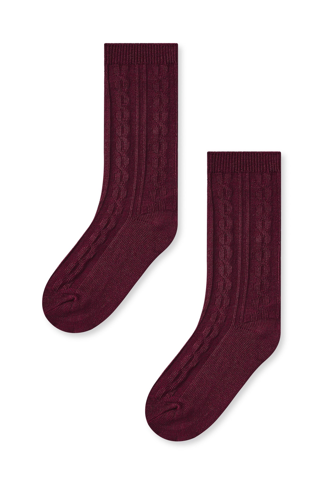 Knee high socks in burgundy laying flat on a white background.