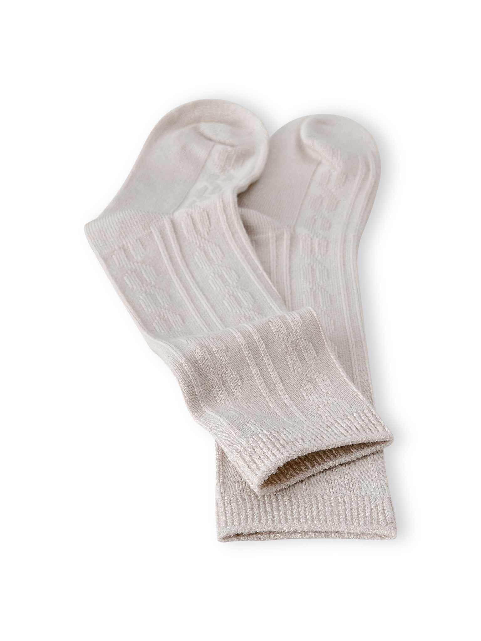 Knee high socks in oat laying flat on a white background.