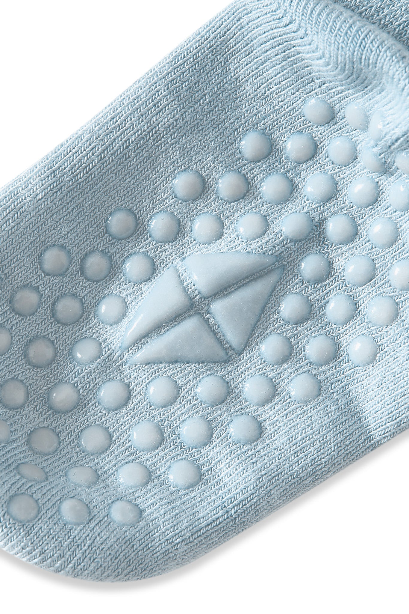 Angled bottom of Kyte sock with grips.