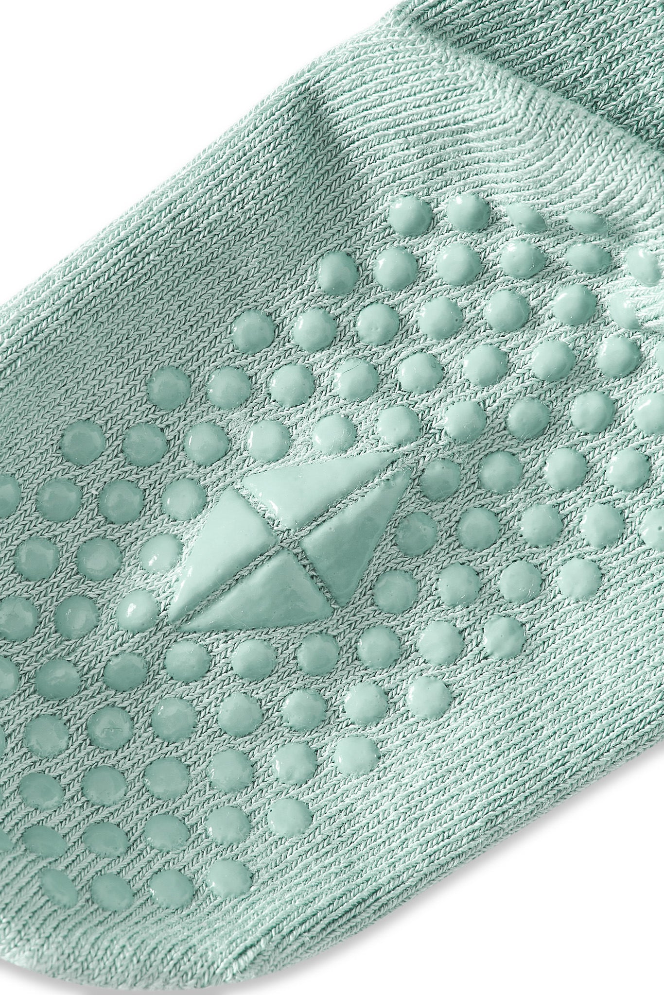 Angled bottom of a Kyte sock with grips.