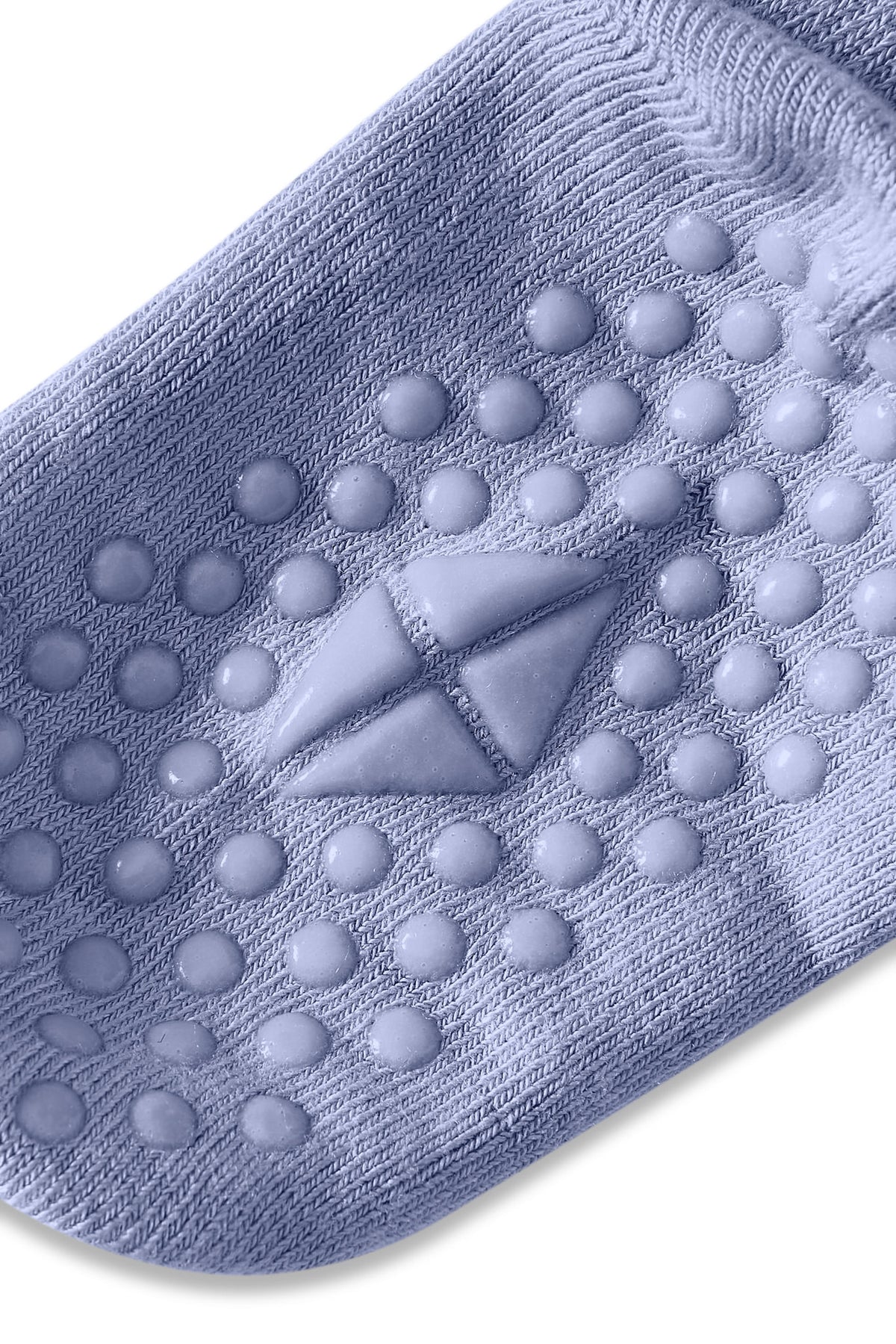 Angled bottom of sock with grips.
