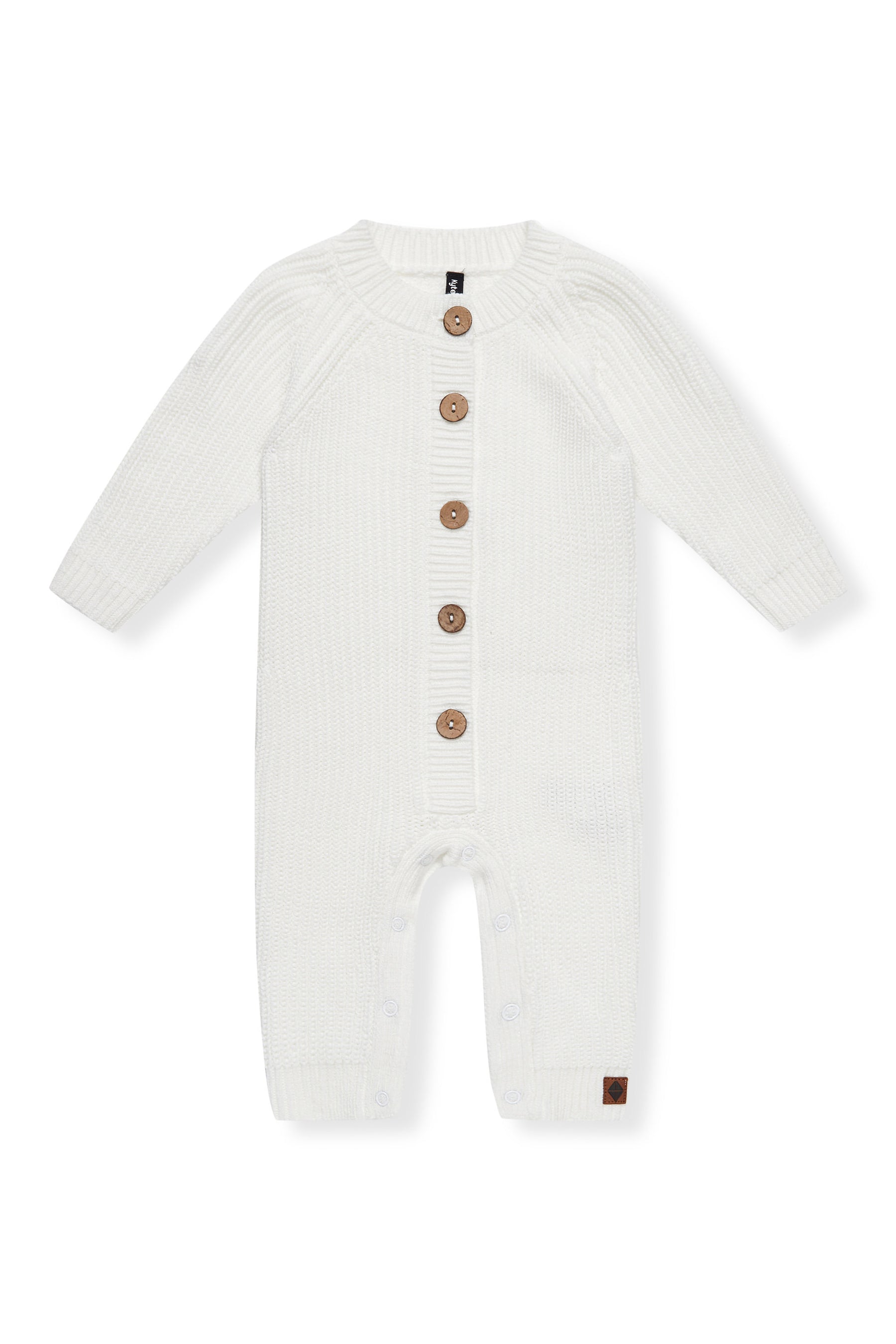 Chunky Knit Jumpsuit in Cloud with buttons on a white background