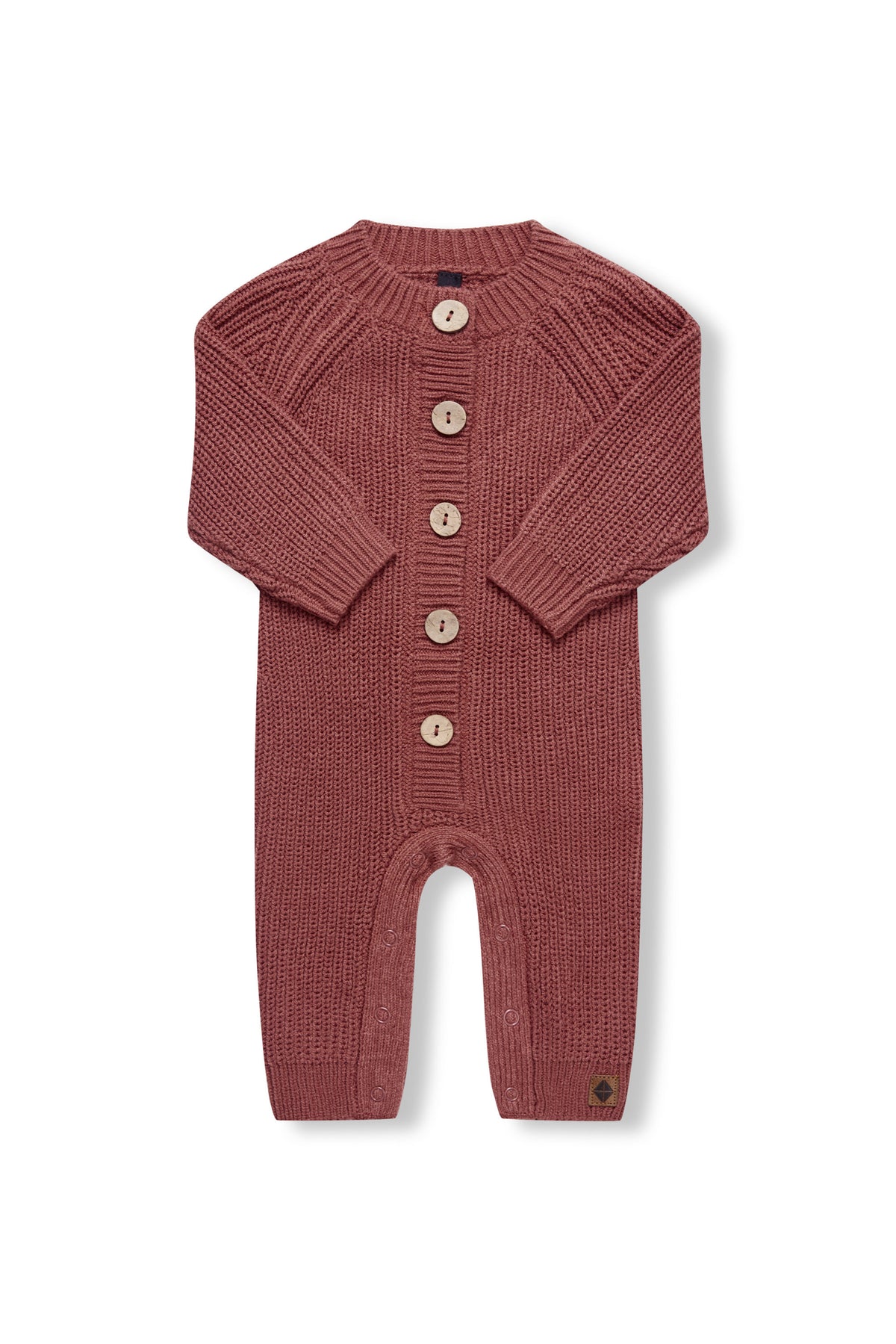 Chunky Knit Jumpsuit in ember with folded sleeves on a white background
