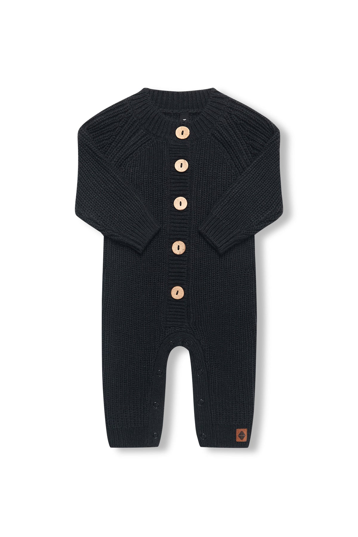 Chunky Knit Jumpsuit in midnight with folded sleeves on a white background