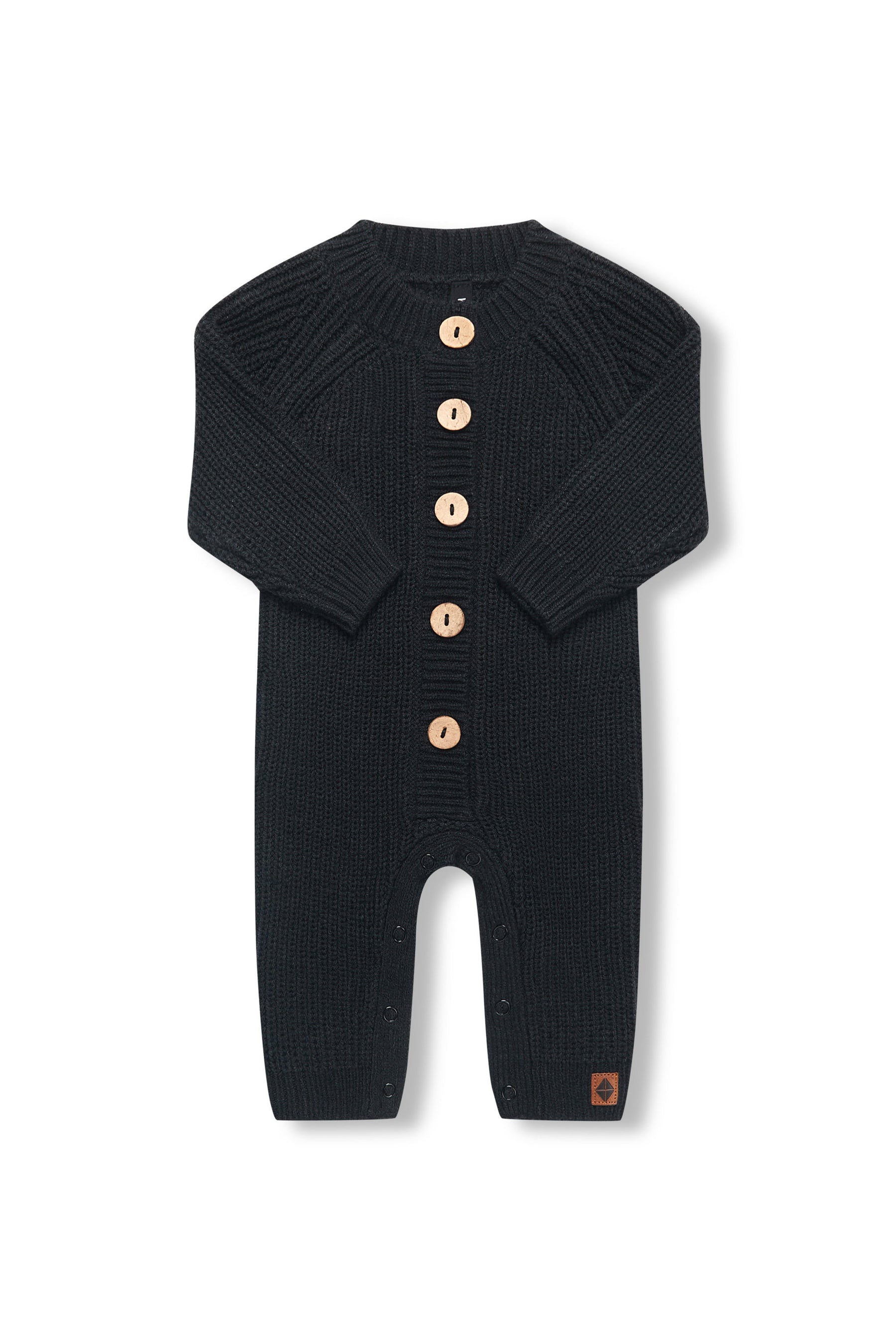 Chunky Knit Jumpsuit in midnight with folded sleeves on a white background