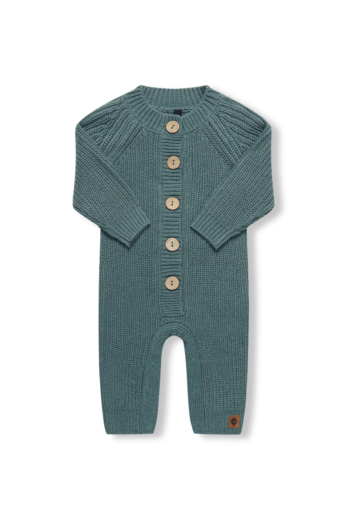 Chunky Knit Jumpsuit in Pine with folded sleeves on a white background