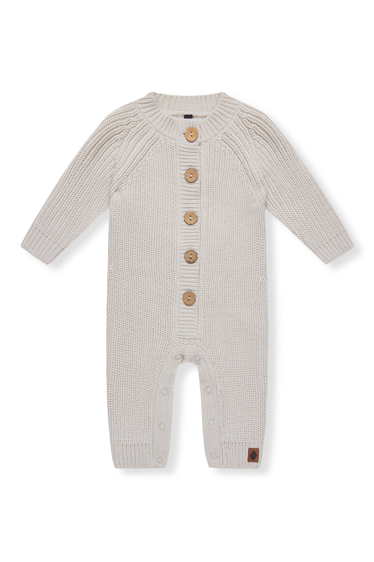 Chunky Knit Jumpsuit in oat with buttons on a white background