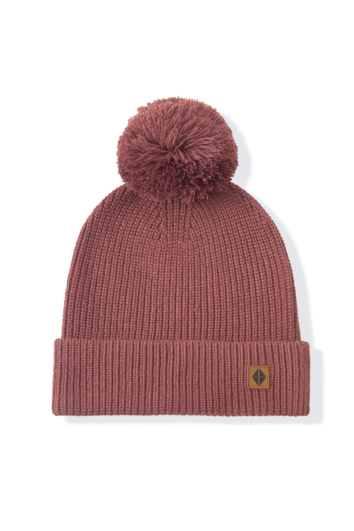 chunky knit beanie with pom in ember on a white background
