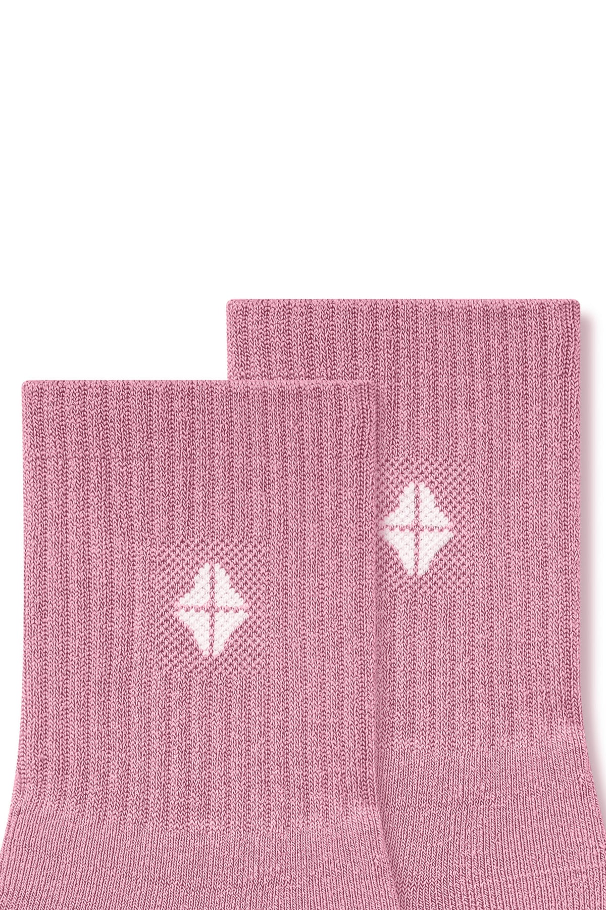 Top part of Adult Crew Socks in Apple Blossom with Kyte Baby logo on a white background