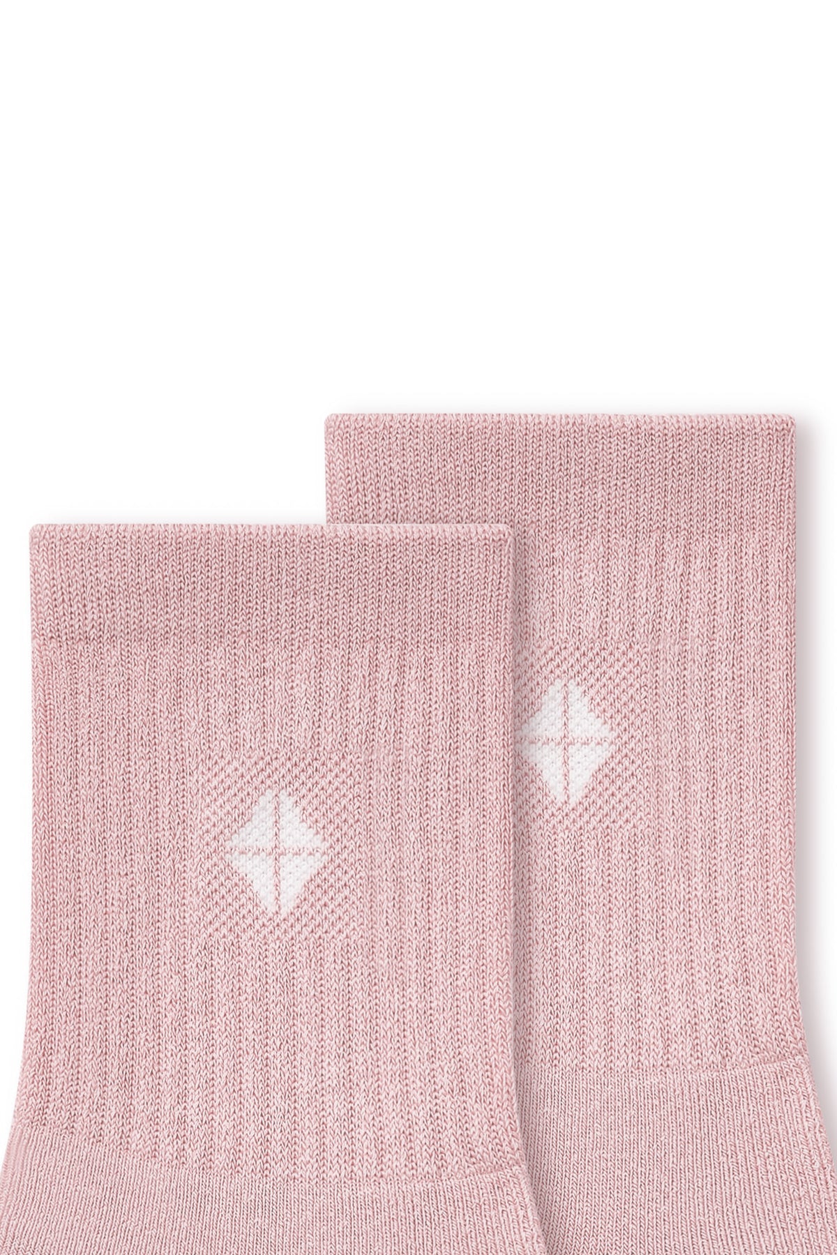 Close up of adult Crew Socks in Blush laying flat on a white background.