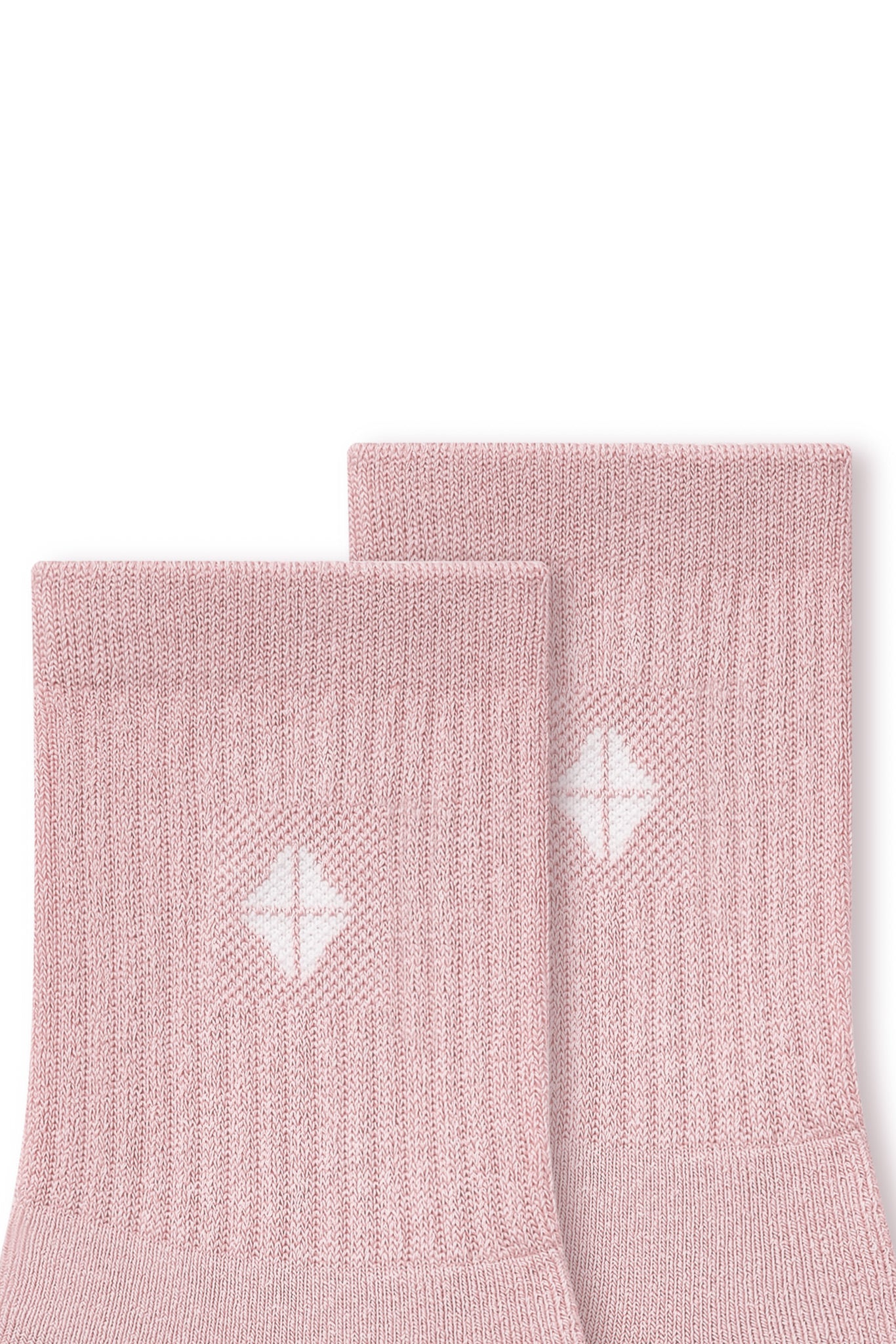 Close up of adult Crew Socks in Blush laying flat on a white background.