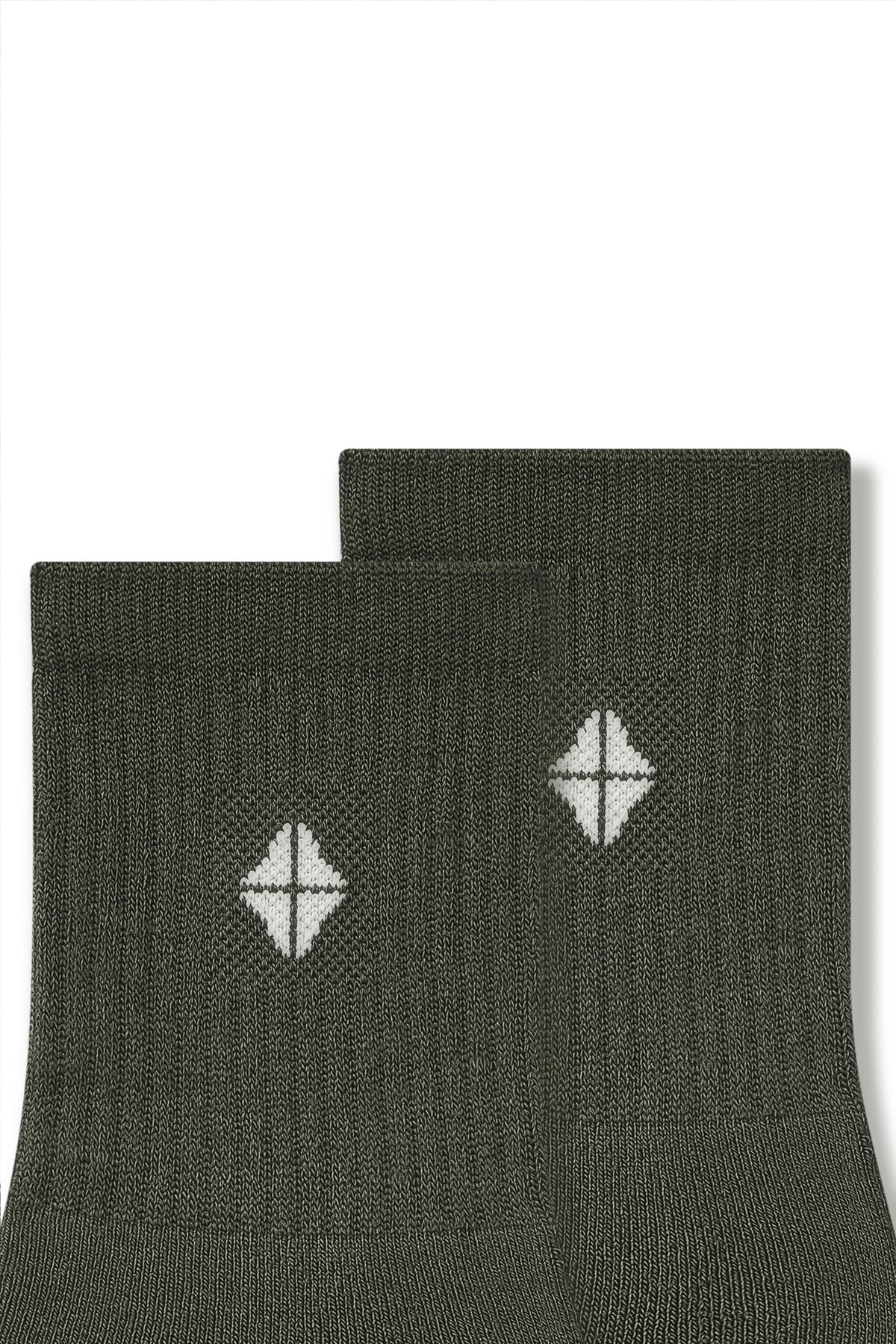 Top part of Adult Crew Socks in Fir with Kyte Baby logo on a white background