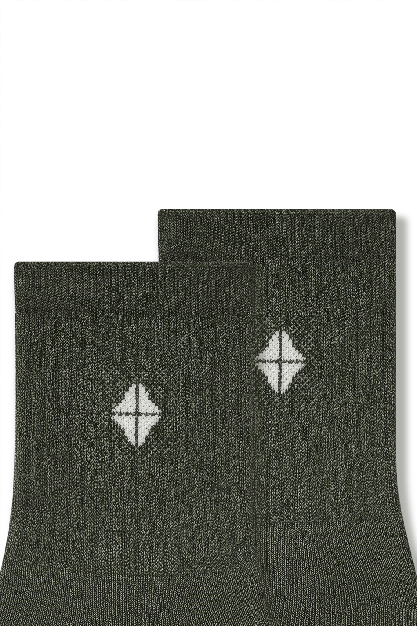 Top part of Adult Crew Socks in Fir with Kyte Baby logo on a white background