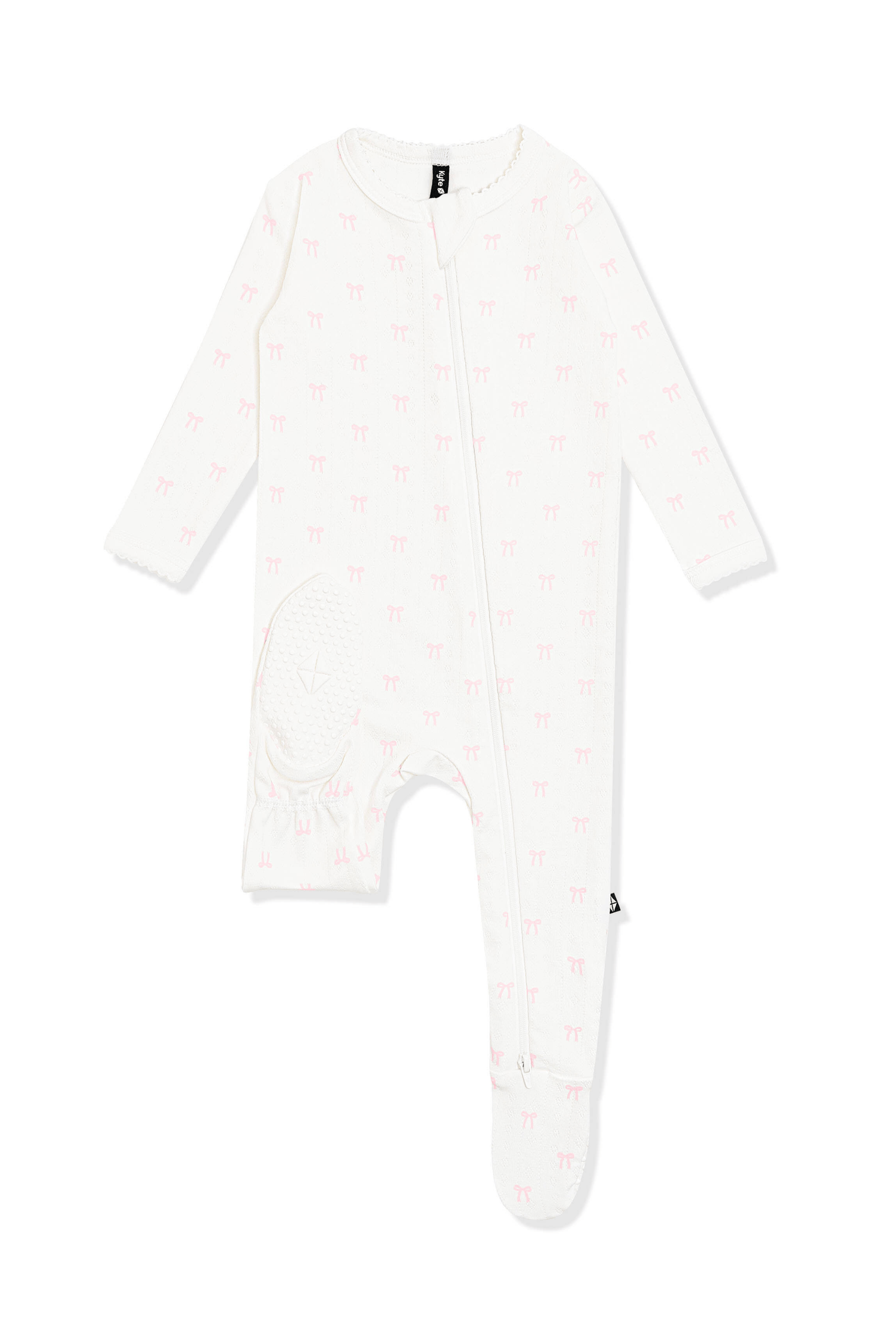 The bottom of the foot showing the kyte baby logo on the Pointelle Zippered Footie in Sweet Pink Bow