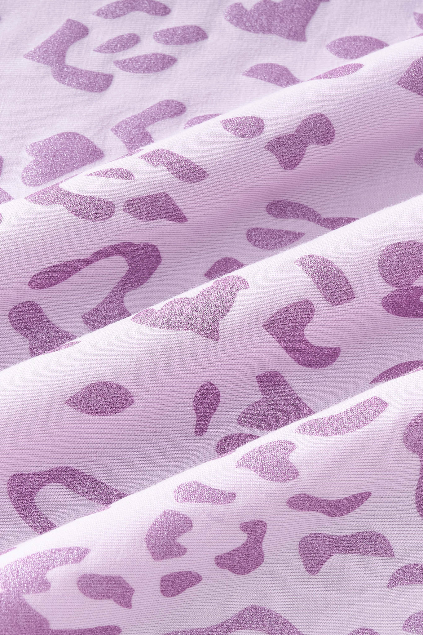 Close up of Thistle Leopard print on pink fabric