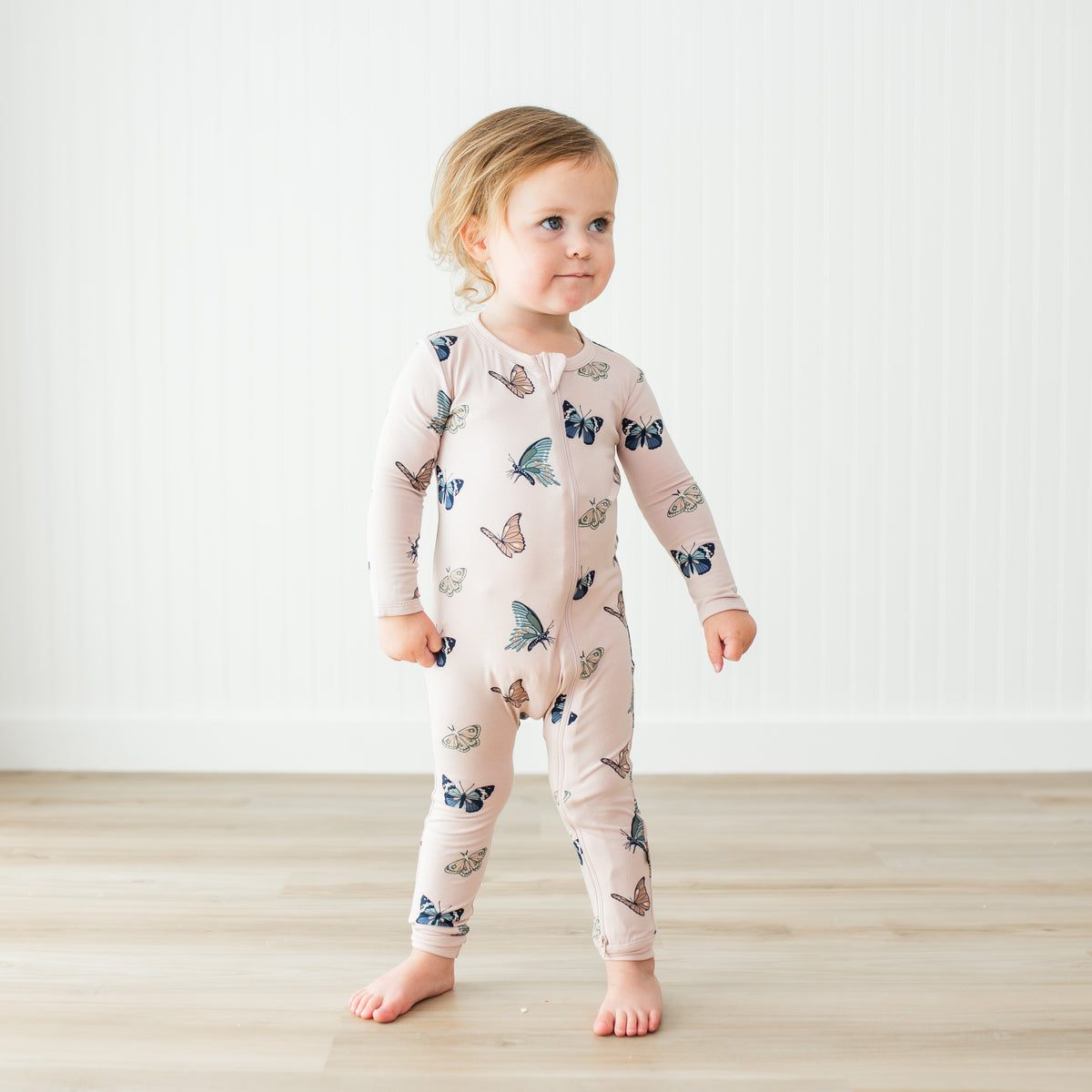Toddler modeling Blush Butterfly Romper 