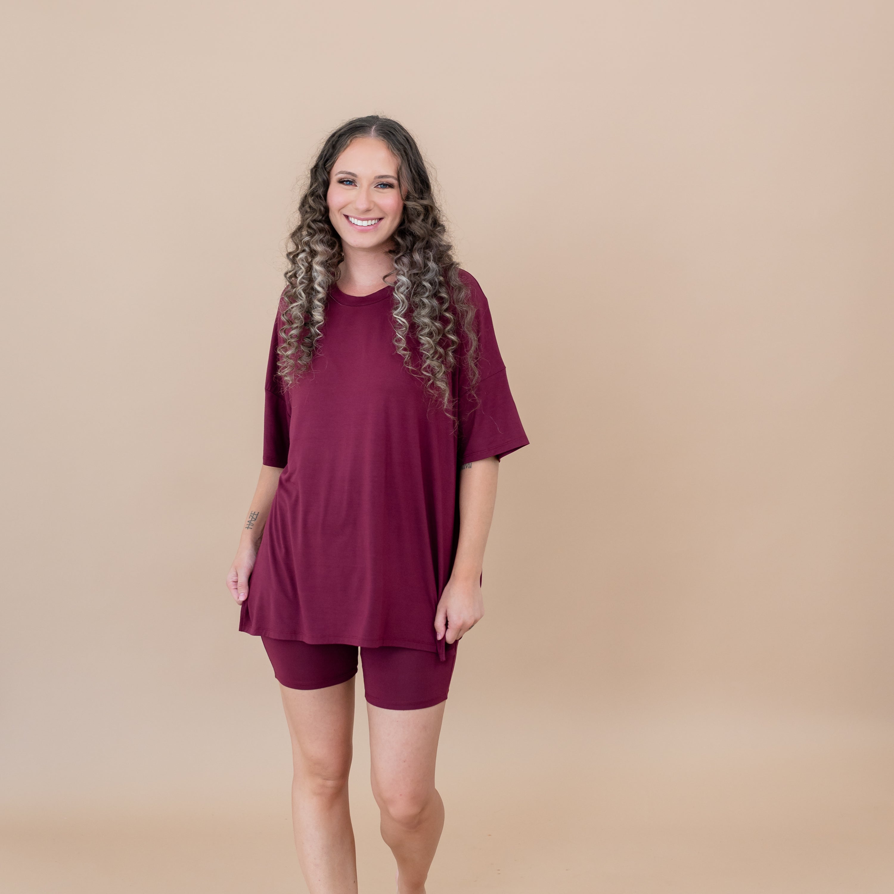 Female model wearing the Women’s Biker Short Set in Burgundy